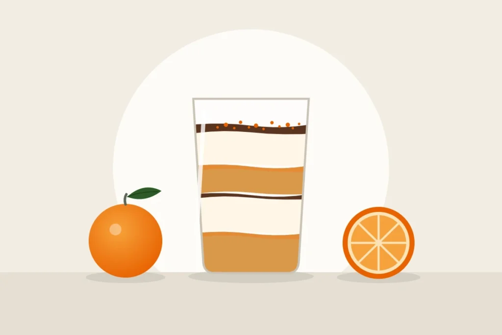 Ilustración de un tiramisú de naranja en vaso, con capas de bizcocho y crema, junto a una naranja y media naranja